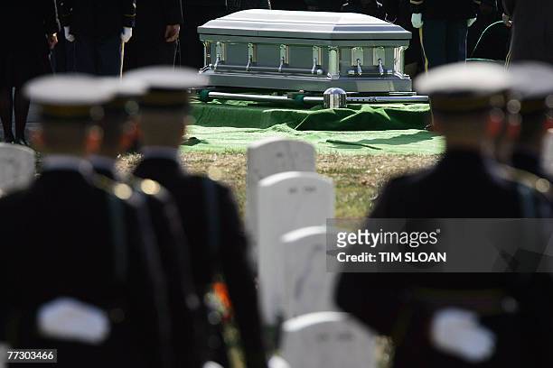 Soldiers from the US 3rd Infantry, traditionally known as the Old Guard, stand during a funeral service for the remains of 12 US army soldiers,...