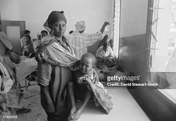Woman and child at a Save The Children Fund feeding centre in Mogadishu during the Somalian civil war, January 1992.