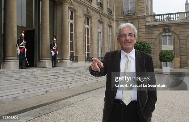 French Nobel Prize winner in Physics, Albert Fert gestures as he arrives to meet with French President Nicolas Sarkozy in the courtyard of the Elysee...
