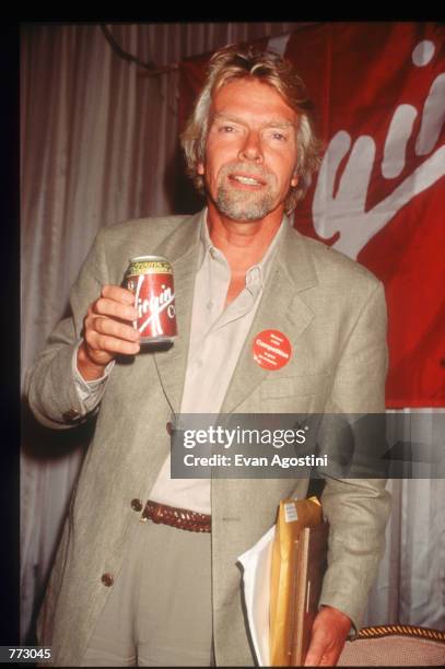 Richard Branson, CEO of Virgin Atlantic Airways drinks Virgin Cola at The Wings Club September 11, 1996 in New York City. Branson discussed his...