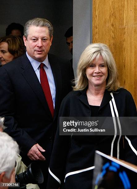 Former U.S. Vice president Al Gore with his wife Tipper Gore arrive to speak to reporters during a news conference discussing his Nobel Peace Prize...