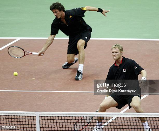 Marat Safin and Dmitry Tursunov of Russia in action against Jo-Wilfried Tsonga and Sebastien Grosjean of France during XVIII International Tennis...