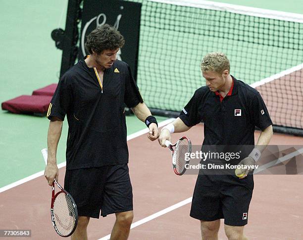 Marat Safin and Dmitry Tursunov of Russia in action against Jo-Wilfried Tsonga and Sebastien Grosjean of France during XVIII International Tennis...