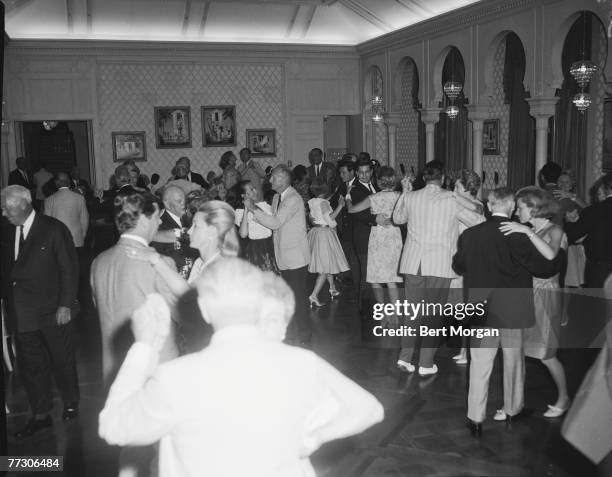 General view of couples as they dance at a party at Mar-A-Lago, Palm Beach, Florida, 1950s. The party was hosted by Marjorie Merriweather Post,...