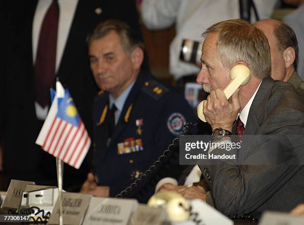 Associate Administrator for Space Operations William Gerstenmaier speaks on the phone to the crews of the International Space Station at the Russian...