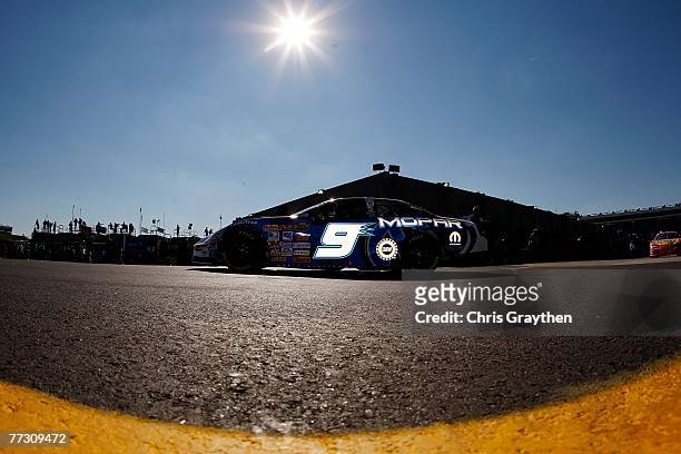 Kasey Kahne, driver of the Dodge Dealers/UAW Dodge, drives in the garage area during practice for the NASCAR Nextel Cup Series Bank of America 500 at...