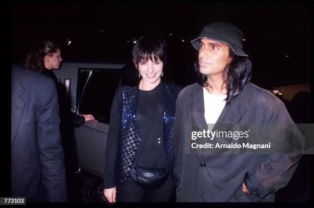 Performer Liza Minnelli stands with celebrity photographer Steven Meisel April 9, 1991 in New York City. Minnelli is in an elite group of artists...