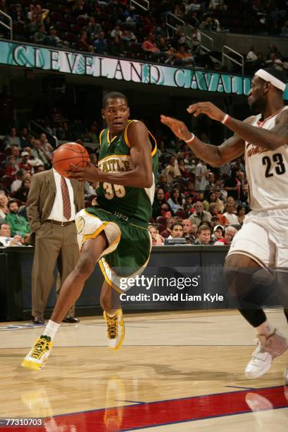 Kevin Durant of the Seattle SuperSonics drives to the hoop against Lebron James of the Cleveland Cavaliers at The Quicken Loans Arena October 12,...