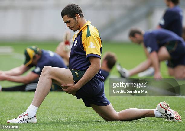 Greg Inglis stretches during the Australian Kangaroos captain's run at Westpac Stadium on October 13, 2007 in Wellington, New Zealand.