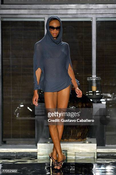 Model walks the runway at the FISICO by Christina Ferrari show at the Setai on October 12, 2007 in Miami Beach, Florida.