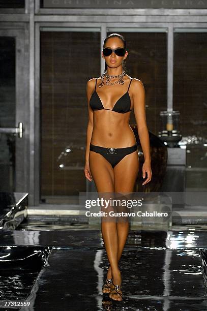 Model walks the runway at the FISICO by Christina Ferrari show at the Setai on October 12, 2007 in Miami Beach, Florida.