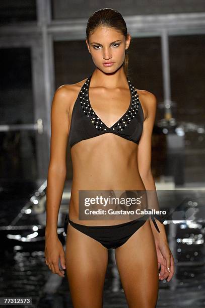 Model walks the runway at the FISICO by Christina Ferrari show at the Setai on October 12, 2007 in Miami Beach, Florida.