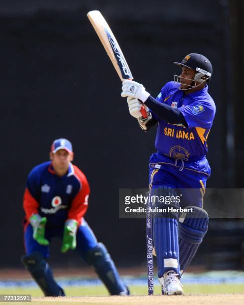 Sanath Jayasuriya of Sri Lanka attacks the bowling of James Anderson as Phil Mustard looks on during the 5th One Day International between Sri Lanka...