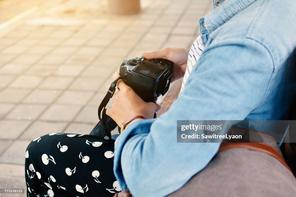 Midsection Of Man Holding Camera