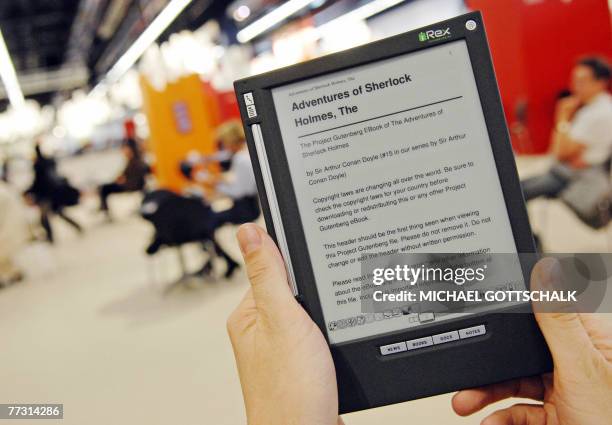 Karel Byloos of the Dutch company iRex reads "Adventures of Sherlock Holmes" on an e-book at the Frankfurt Book Fair 12 October 2007. The fair's...