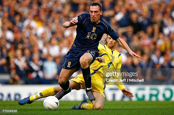 Scott Brown of Scotland is tackled by Anatoliy Tymoschuk of Ukraine during the Euro 2008 Group B qualifying match between Scotland and Ukraine at...