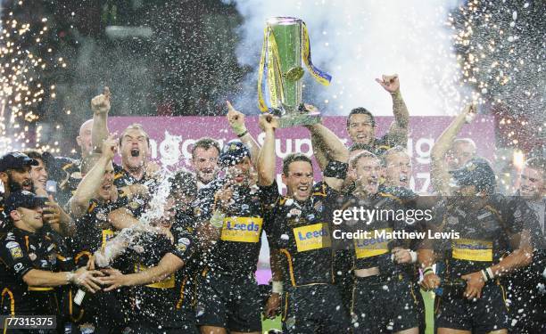 Leeds Rhinos players celebrate winning the engage Super League Trophy after defeating St.Helens in the engage Super League Grand Final match between...