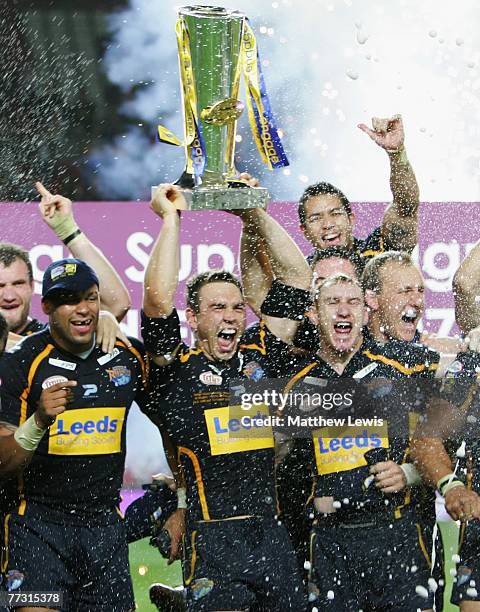 Leeds Rhinos players celebrate winning the engage Super League Trophy after defeating St.Helens in the engage Super League Grand Final match between...