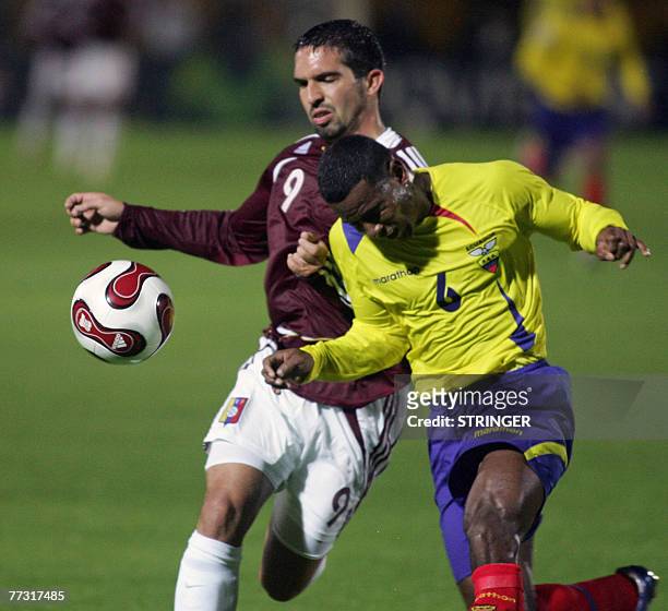 Ecuadorean Oscar Bagui vies for the ball with Venezuelan Giancarlo Maldonado 13 October, 2007 in the Atahualpa Olympic stadium in Quito during their...