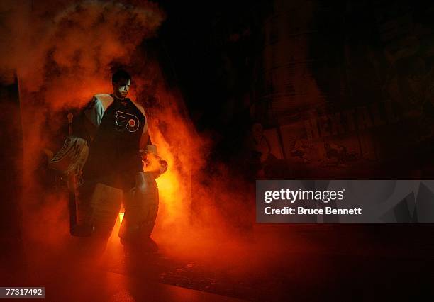 Goaltender Martin Biron of the Philadelphia Flyers walks out to the ice during introductions prior to their game against the New York Islanders at...