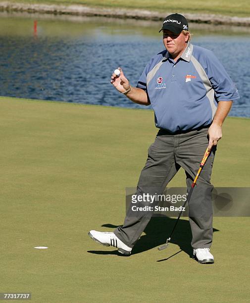 John Daly waves to the gallery during the third round of the Frys.com Open benefiting Shriners Hospitals for Children at TPC Summerlin on October 13,...