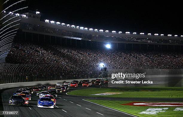 Ryan Newman, driver of the Alltel Dodge, and Jimmie Johnson, driver of the Lowe's/Kobalt Tools Chevrolet, lead the field to start the NASCAR Nextel...