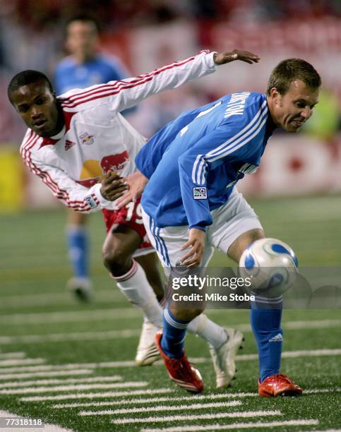 Michael Harrington of the Kansas City Wizards and Dane Richards of the New York Red Bulls chase the ball during their match at Giants Stadium in the...