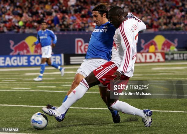 Jozy Altidore of the New York Red Bulls battles for the ball against Nick Garcia of the Kansas City Wizards on October 13, 2007 at Giants Stadium in...