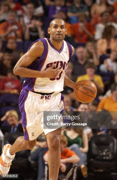 Grant Hill of the Phoenix Suns brings the ball upcourt against the New Orleans Hornets at U.S. Airways Center October 13, 2007 in Phoenix, Arizona....