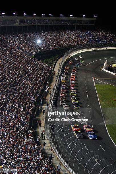 Ryan Newman, driver of the Alltel Dodge, and Jimmie Johnson, driver of the Lowe's/Kobalt Tools Chevrolet, lead the field to start the NASCAR Nextel...