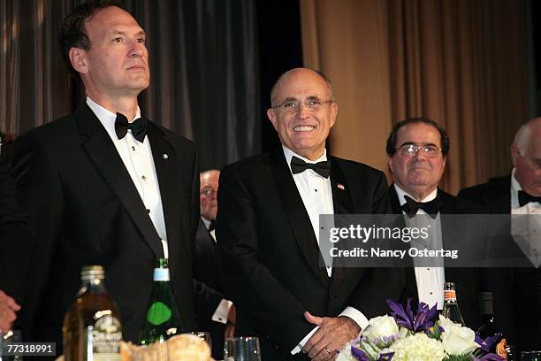 Justice Samuel Alito, Jr., Rudy Giuliani , and Justice Antonin Scalia are seen on stage at NIAF's 32nd Anniversary Awards Gala on October 13, 2007 in...