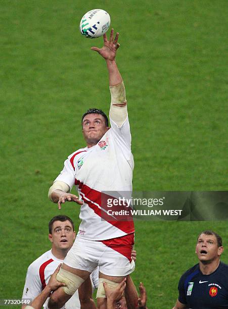 England's flanker Martin Corry grabs the ball in a line-out as England's prop Andrew Sheridan and France's prop Pieter De Villiers look up during the...