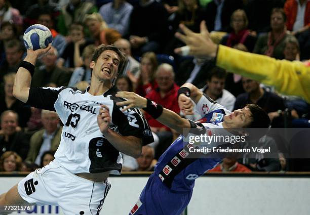 Markus Ahlm of Kiel fights for the ball with Dennis Wilke of Balingen during the Bundesliga Handball match between THW Kiel and HBW...