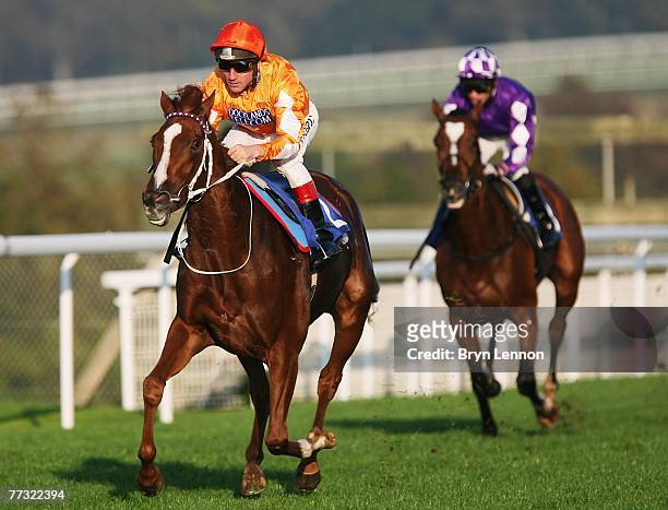 Fringe ridden by jockey John Egan wins The TurfTV for Betting Shops Median Auction Maiden Stakes race at Goodwood Racecourse on October 14 in...
