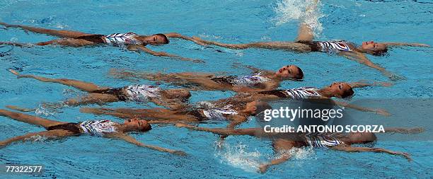 Japan's synchronized swimming team perform during their combination routine, 14 October 2007, in the Synchronized Swimming World Trophy 2007 at the...