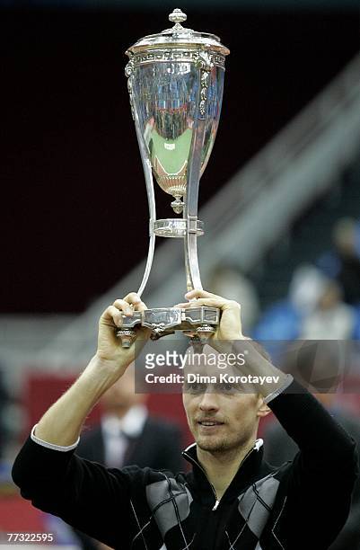 Nikolay Davydenko of Russia holds the trophy after defeating Mathieu Paul-Henri of France during the final of the XVIII International Tennis...
