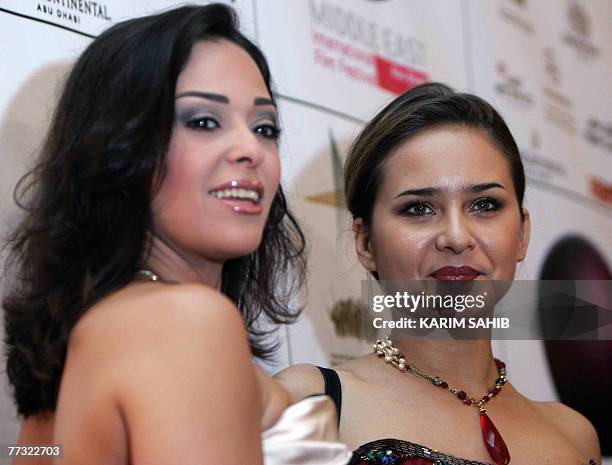 Egyptian actresses Dalia al-Biheri and Nelly Karim arrive to the opening of the Middle East International Film Festival in Abu Dhabi, 14 October...