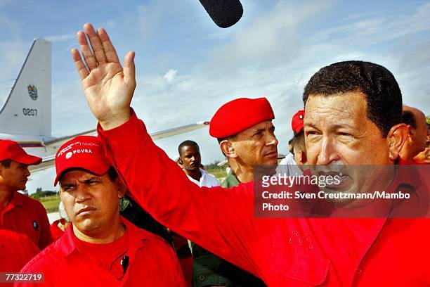 Hugo Chavez, President of Venezuela, talks to the press as he arrives at the Santa Clara airport October 14, 2007 in Santa Clara, Cuba. Chavez will...
