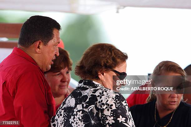 Venezuelan president Hugo Chavez speaks with Aleida March , widow of Ernesto Che Guevara and Celia Guevara , daughter of the late leader, before the...