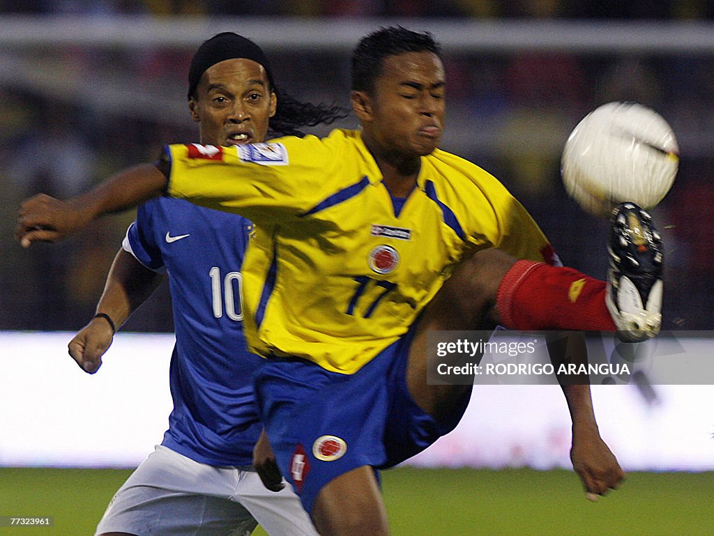 Colombia's Jaime Castrillon (R) tries to