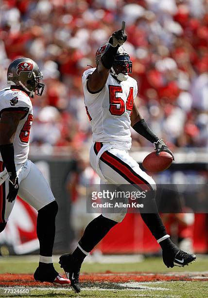 Linebacker Patrick Chukwurah of the Tampa Bay Buccaneers celebrates a play against the Tennessee Titans at Raymond James Stadium on October 14, 2007...