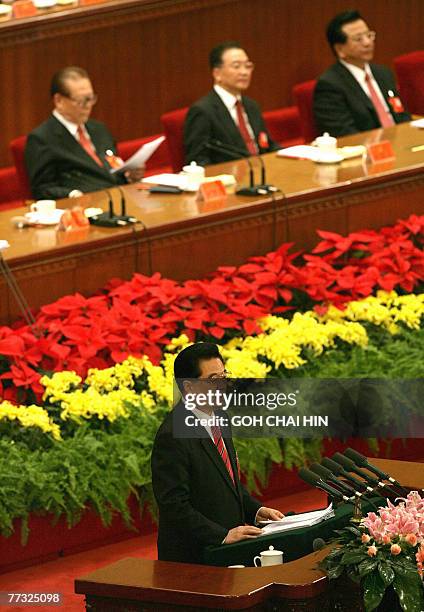 Chinese President Hu Jintao delivers his address, with former president Jiang Zemin , Premier Wen Jiabao and Vice President Zeng Qinghong in the...