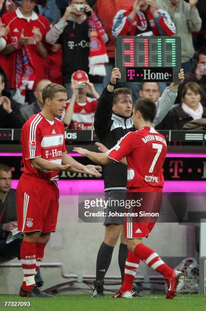 Franck Ribery of Bayern is exchanged for Lukas Podolski during the Bundesliga match between Bayern Munich and Nuremberg at the Allianz Arena on...
