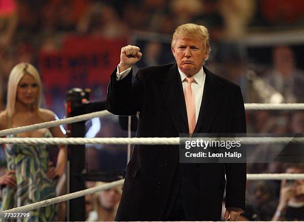 Donald Trump and Terra Conner former Miss USA in the ring before the start of the main event of the night, "Hair vs. Hair", between Vince McMahon and...