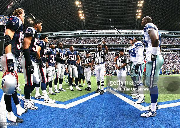 Captains from the Dallas Cowboys and the New England Patriots meet at mid-field pre-game for the coin toss at Texas Stadium on October 14, 2007 in...