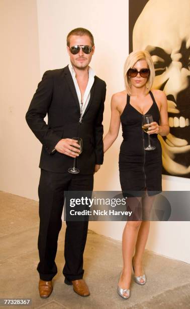 David Beckham and Victoria Beckham lookalike attend the Phillips De Pury and Company and Taschen Party to launch Confidential by Alison Jackson at...