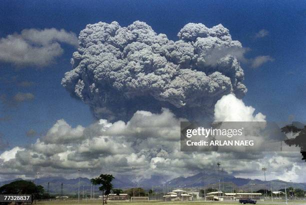 This picture taken 12 June 1991 shows a giant mushroom cloud of steam and ash exploding out of Mount Pinatubo volcano during its eruption as seen...