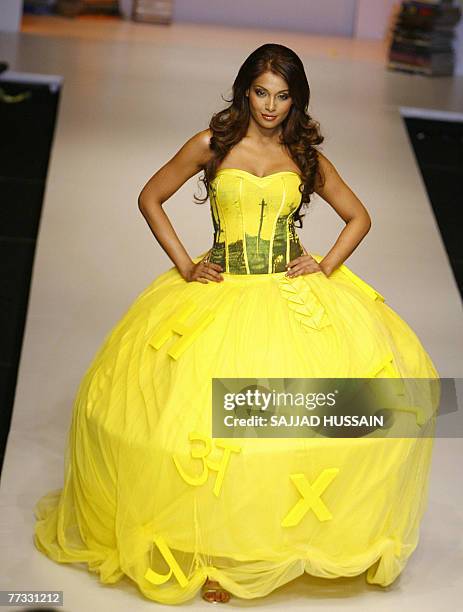 Indian Bollywood actress Bipasha Basu displays a creation by Indian designer Narendra Kumar during the Lakme Fashion Week at the National Centre for...