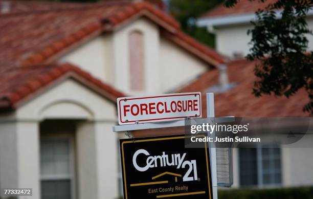 For sale sign is seen in front of a foreclosed home October15, 2007 in Antioch, California. The San Francisco Bay Area zip code 94531, Antioch,...