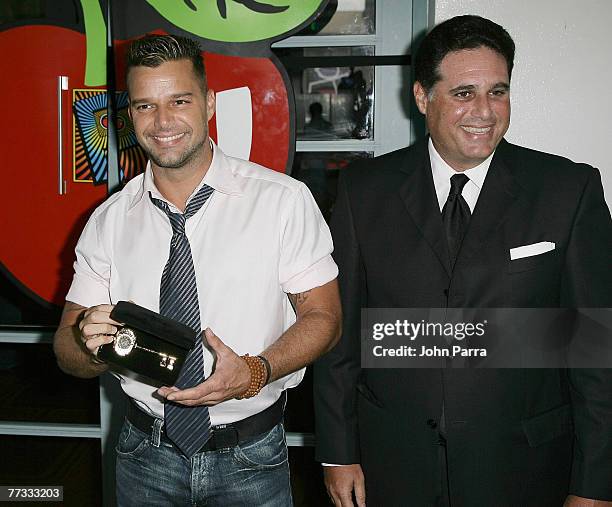 Miami Beach Mayor David Dermer presents the key to the city to Latin recording artist Ricky Martin at the Grand Opening of the Fillmore Miami Beach...